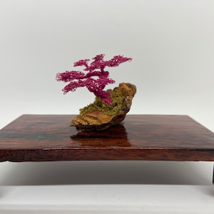 Small Pink Semi Cascade wire bonsai on a small piece of Boulder Opal with flocking for the grass.