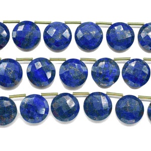 May include: A strand of round, faceted lapis lazuli beads with gold spacers. The beads are a deep blue colour with flecks of gold pyrite.