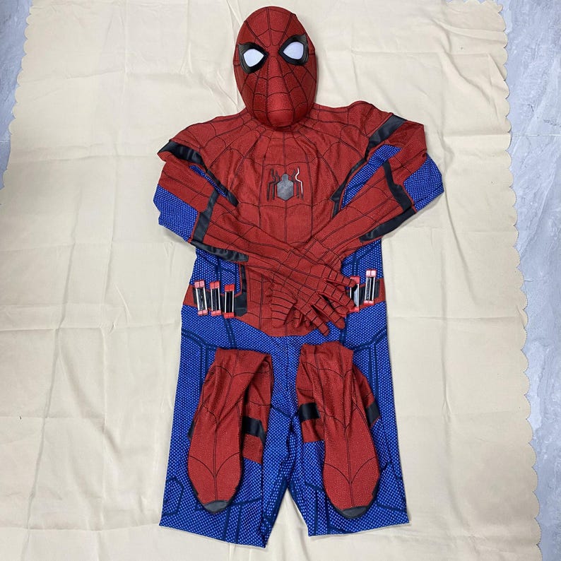 May include: A red and blue Spider-Man costume set, including a mask, jumpsuit, and gloves. The jumpsuit is red with black accents on the arms and a blue lower body. The mask has white eye lenses.