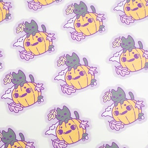 May include: A repeating pattern of stickers featuring a black cat sitting on top of a yellow pumpkin with a white ghost behind it. The stickers are surrounded by purple leaves and are on a white background.