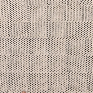 May include: A white fabric with a black checkered pattern. The fabric has a subtle texture and a slightly distressed look.