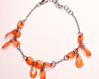 Bracelet/anklet in orange recycled plastic and steel