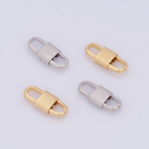 May include: Four metal clasps, two gold and two silver, with a textured design. The clasps are oval shaped with a small rectangular section in the middle.