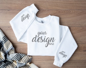 May include: White sweatshirt with long sleeves and a crew neck. The sweatshirt has the text "your design here" printed on the front and both sleeves.