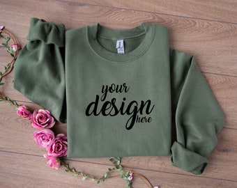 May include: A green sweatshirt with the text "your design here" printed on the front.