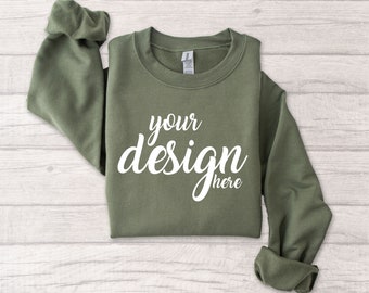 May include: A green sweatshirt with the text "your design here" in white.