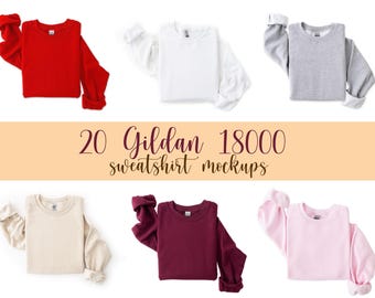 May include: A collection of Gildan 18000 sweatshirt mockups in various colors, including red, white, gray, beige, burgundy, and pink. The sweatshirts are displayed with their sleeves rolled up, showcasing the cuffs. The text "20 Gildan 18000 sweatshirt mockups" is also visible.
