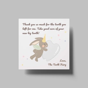 May include: A tooth fairy note with a cartoon bunny holding a tooth. The note says "Thank you so much for the tooth you left for me. Take good care of your new big tooth! Love, The Tooth Fairy."