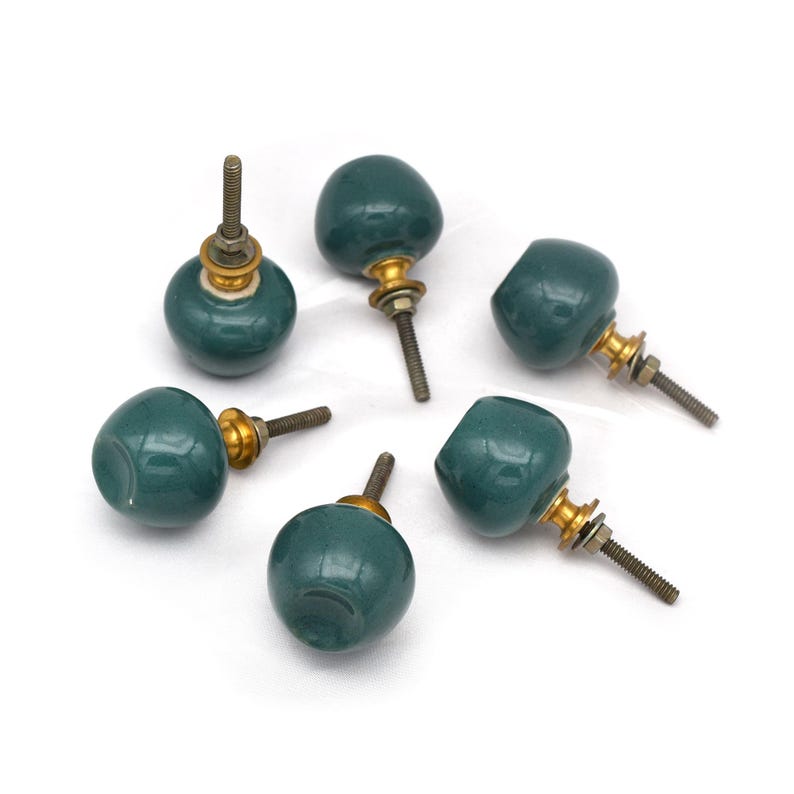 Pair of green ceramic knobs with brass hardware, perfect as drawer knobs or cabinet pulls.