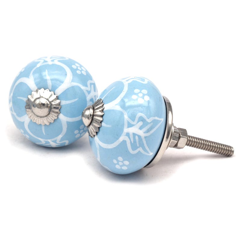 sky-blue ceramic knobs with white floral patterns and metal screws; ideal cabinet, dresser, or drawer knobs for kitchen door pulls.