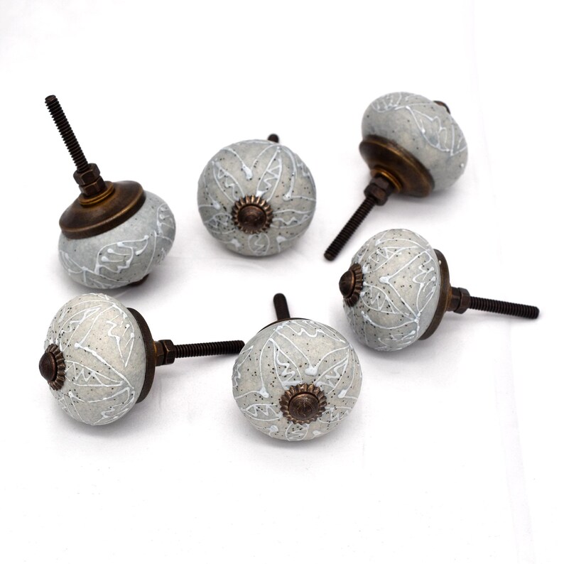 Gray ceramic knobs with hand-painted white mandala floral pattern, bronze back, threaded metal screw, home decor hardware