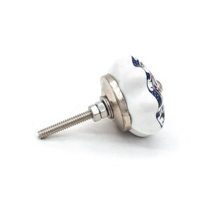 Hand-painted ceramic pumpkin knob in blue, green, and red with floral motif for kitchen cabinet knobs.