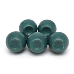 Pair of green ceramic knobs with brass hardware, perfect as drawer knobs or cabinet pulls.