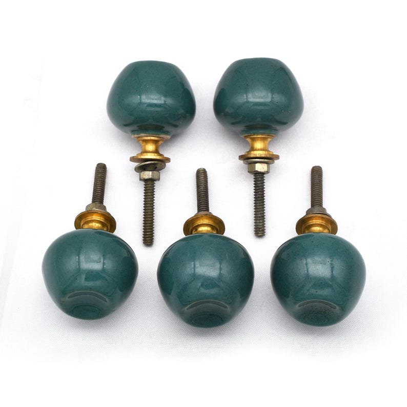 Pair of green ceramic knobs with brass hardware, perfect as drawer knobs or cabinet pulls.