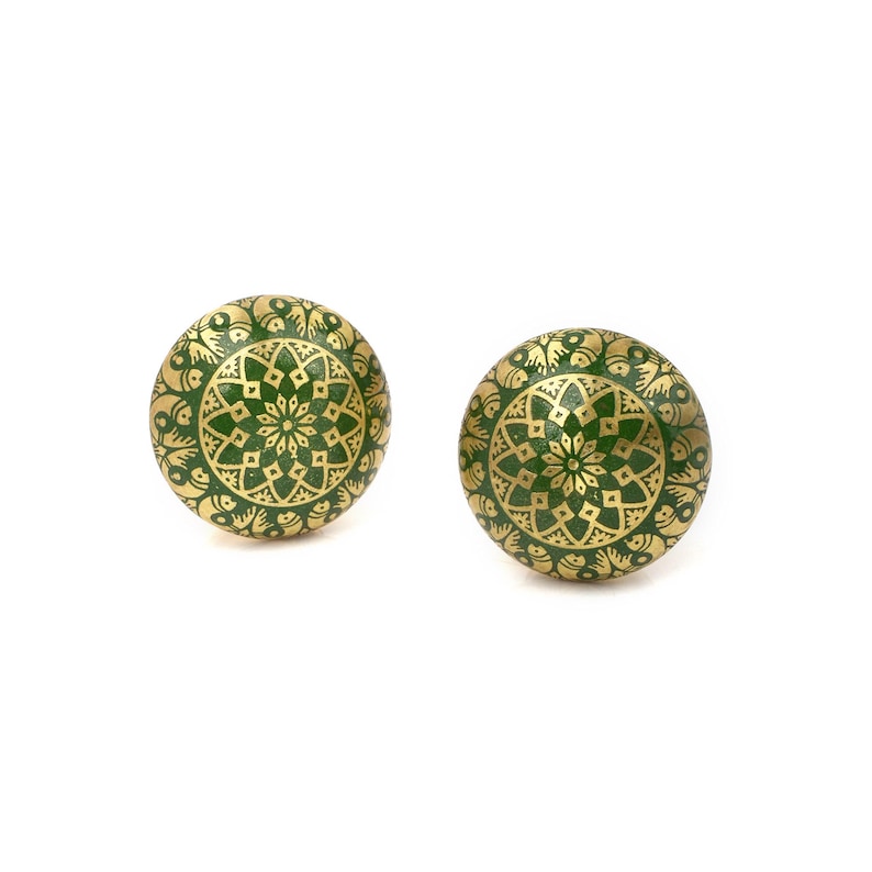 Brass cabinet knobs in vintage style with green and gold etched mandala pattern; decorative drawer pulls for furniture hardware.