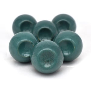 Pair of green ceramic knobs with brass hardware, perfect as drawer knobs or cabinet pulls.