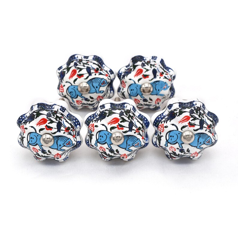 Hand-painted ceramic pumpkin knob in blue, green, and red with floral motif for kitchen cabinet knobs.