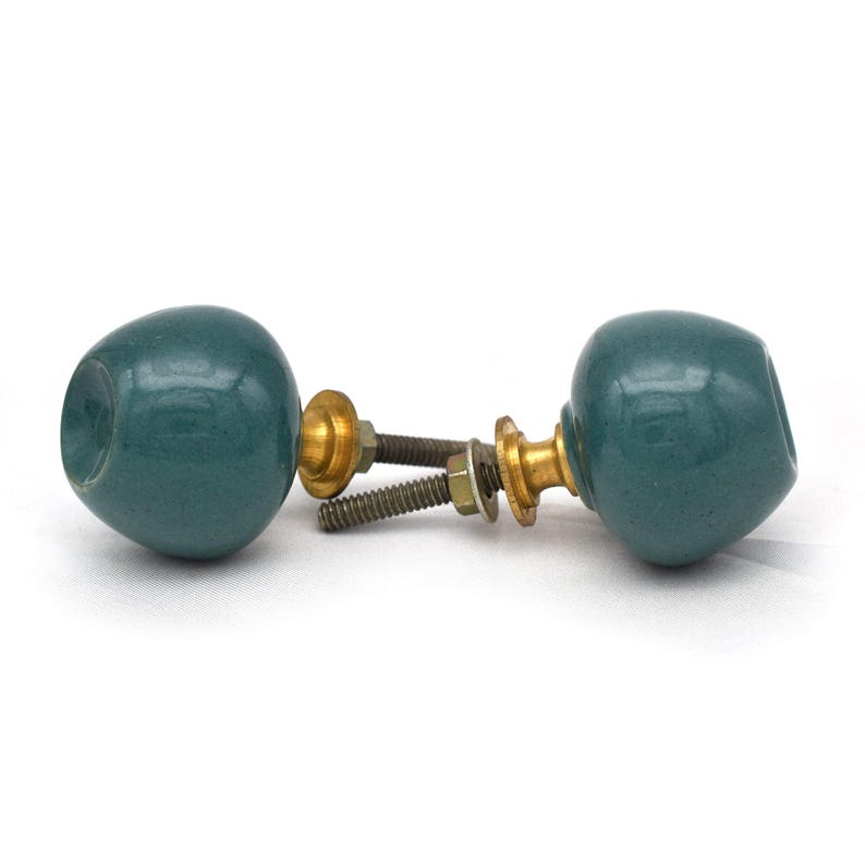 Pair of green ceramic knobs with brass hardware, perfect as drawer knobs or cabinet pulls.