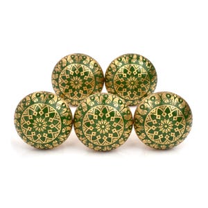 Brass cabinet knobs in vintage style with green and gold etched mandala pattern; decorative drawer pulls for furniture hardware.