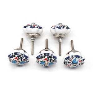 Hand-painted ceramic pumpkin knob in blue, green, and red with floral motif for kitchen cabinet knobs.