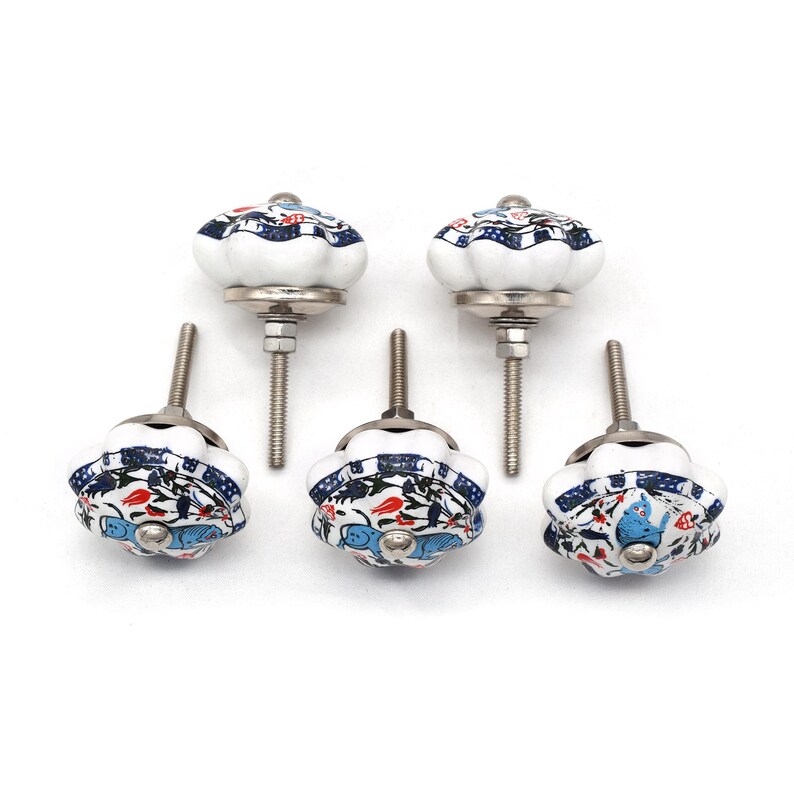 Hand-painted ceramic pumpkin knob in blue, green, and red with floral motif for kitchen cabinet knobs.