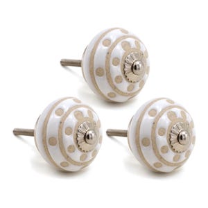 May include: Three white ceramic cabinet knobs with a beige swirl and dot pattern. Each knob has a silver metal screw.