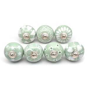 Green and white knobs for drawers and cabinets available in different design