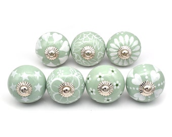 Green and white knobs for drawers and cabinets available in different design