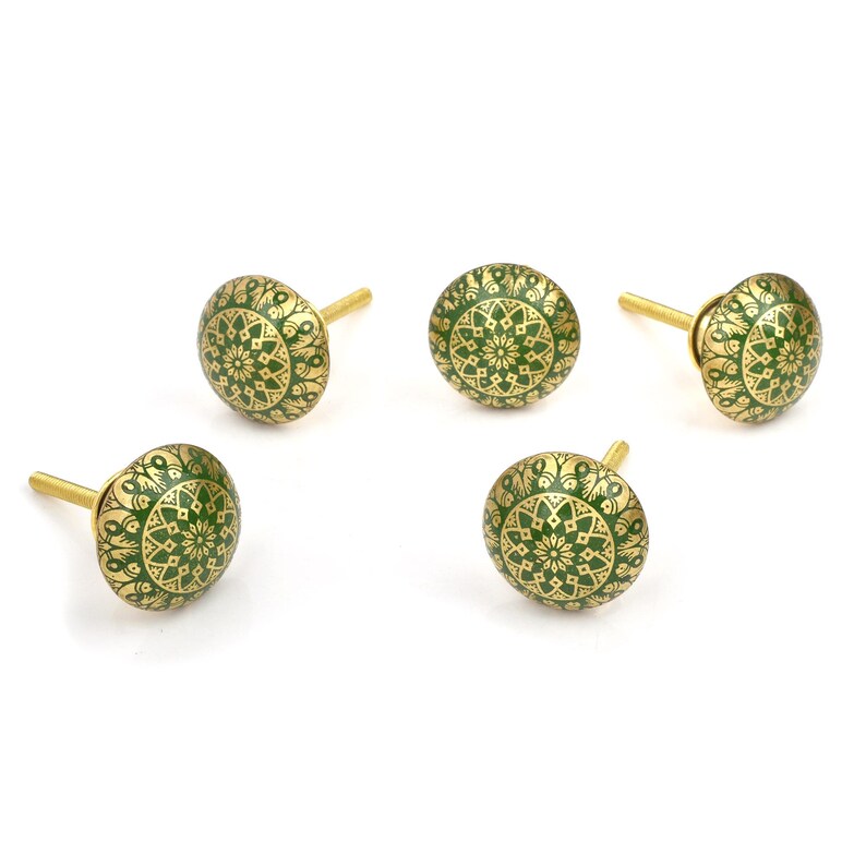 Brass cabinet knobs in vintage style with green and gold etched mandala pattern; decorative drawer pulls for furniture hardware.