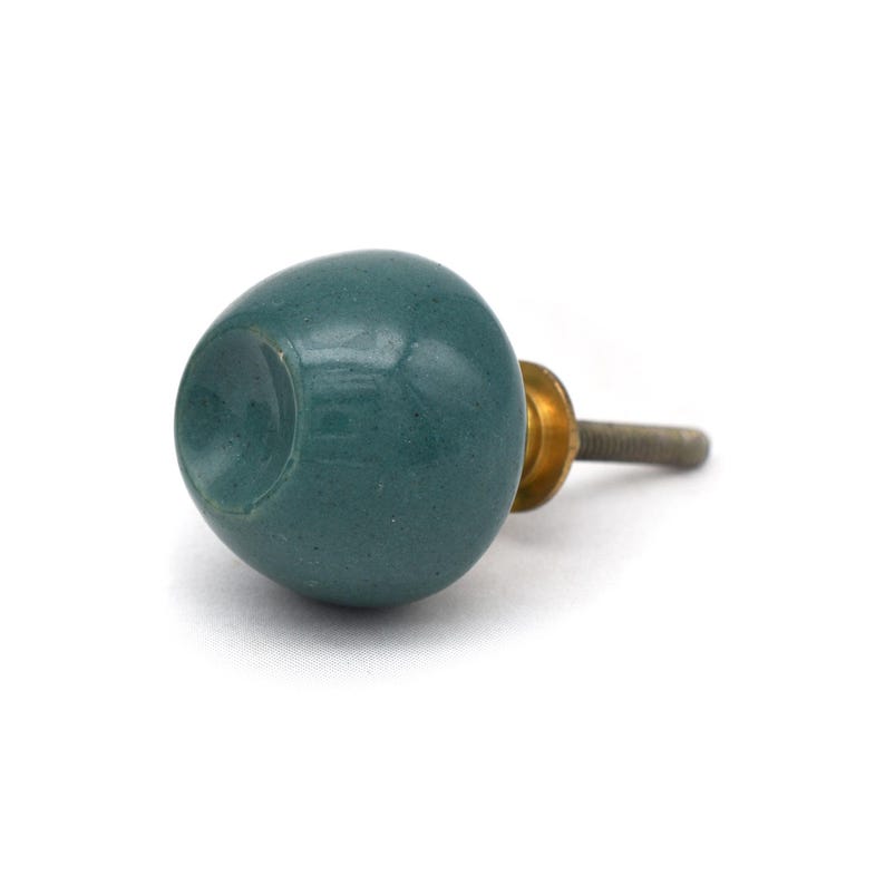 Pair of green ceramic knobs with brass hardware, perfect as drawer knobs or cabinet pulls.