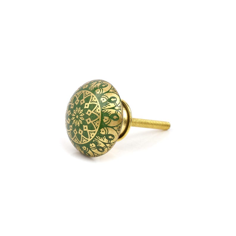 Brass cabinet knobs in vintage style with green and gold etched mandala pattern; decorative drawer pulls for furniture hardware.