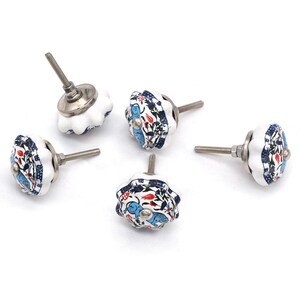 Hand-painted ceramic pumpkin knob in blue, green, and red with floral motif for kitchen cabinet knobs.