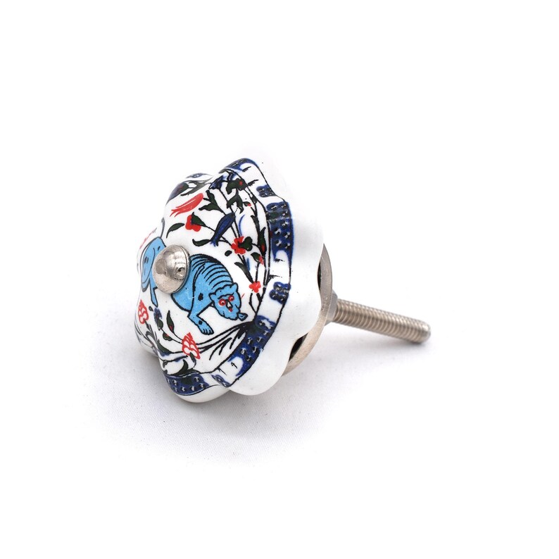 Hand-painted ceramic pumpkin knob in blue, green, and red with floral motif for kitchen cabinet knobs.
