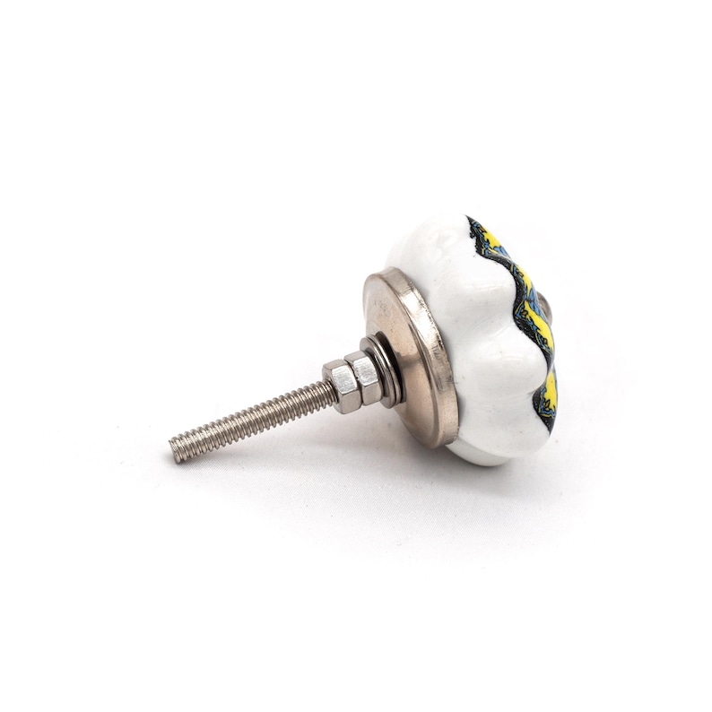 Hand-painted ceramic furniture knob with scalloped edge, yellow and blue mandala pattern, metal screw center for drawer pull.