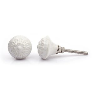 May include: A collection of twelve decorative cabinet knobs in various colours and patterns. Each knob features a round or oval shape with a metal bolt extending from the back. The designs include floral, geometric, and solid textures in shades of green, blue, orange, purple, white, and grey.