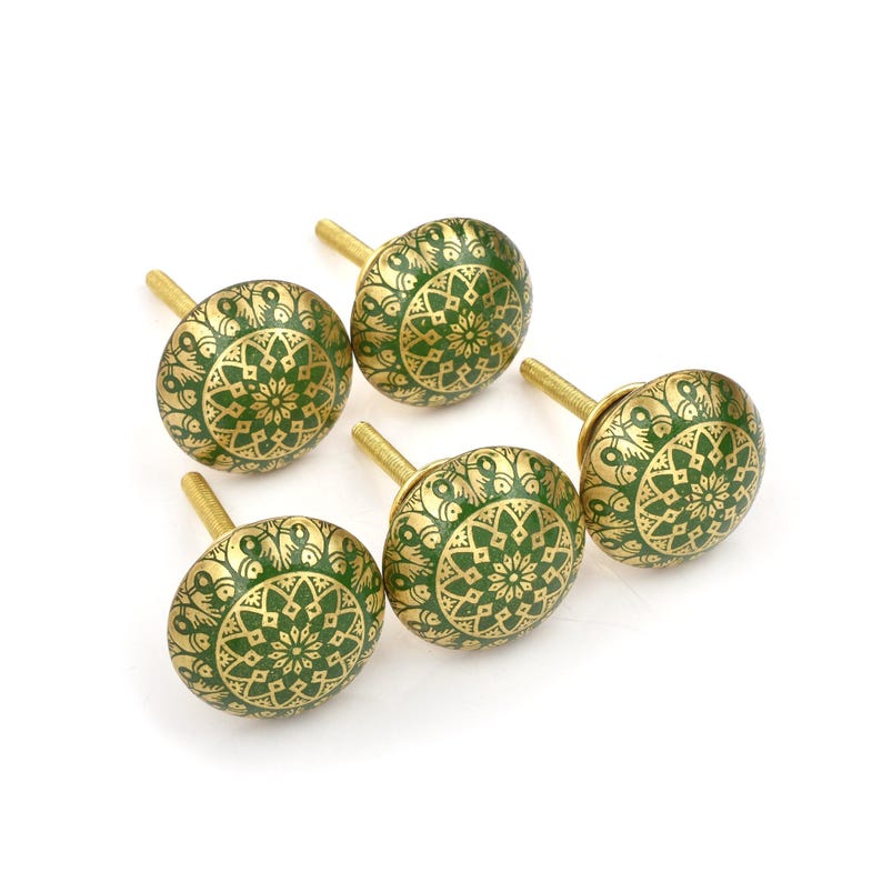 Brass cabinet knobs in vintage style with green and gold etched mandala pattern; decorative drawer pulls for furniture hardware.