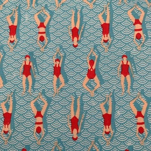 May include: A blue and white fabric with a repeating pattern of red figures swimming in a wavy pattern.
