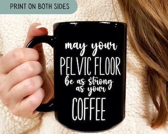 May include: Black coffee mug with white text that reads "may your pelvic floor be as strong as your coffee".