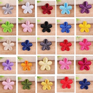 May include: A selection of embroidered flower patches in a range of colours, such as grey, white, red, blue, purple, green, black, yellow, and pink. Each patch has a five-petal design, suitable for craft and embellishment projects.