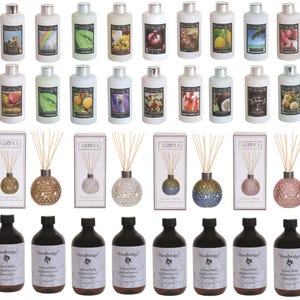May include: A collection of Woodbridge home fragrance products including eighteen white bottles with various labels, six spherical glass reed diffusers with wooden sticks and matching boxes, and eight amber bottles labelled Diffuser Refill.