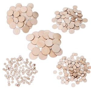 May include: Several piles of small, unfinished wooden circles. The circles are of varying sizes and made from light-coloured wood. These craft supplies are suitable for DIY projects, scrapbooking, or other creative activities.