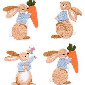 May include: Four embroidered bunny patches. Each bunny is light brown with tan ears, wearing a blue jacket and holding a carrot or flowers. The carrots are orange with green tops. The patches are on a white background.