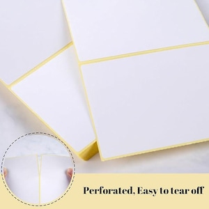 May include: Close-up of white rectangular labels with yellow backing. The labels are perforated for easy tearing. The text "Perforated, Easy to tear off" is displayed at the bottom of the image.