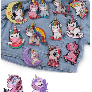 May include: A selection of colourful unicorn patches in various designs, including unicorns on skateboards, rainbows, and moons. The patches feature vibrant colours and are displayed on a denim jacket.