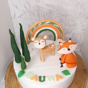 Cake decoration: forest animals fox and deer made of fondant