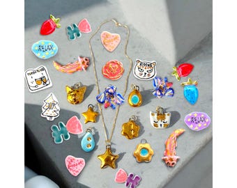 Custom Porcelain charms . Light weight Ceramic Jewellery.  Personalised porcelain beeds.Chain an option .Exclusive gold Ceramic pendants.