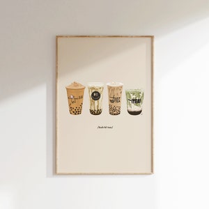 May include: A framed print of four illustrated cups of bubble tea with different flavors. The cups are labeled "Smoothie King", "Boba Guys", "Just Boba Tea", and "Itea". The text below the cups reads "/buh-bi tee/".