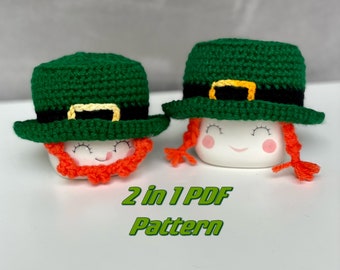 May include: Two white ceramic mugs, each adorned with a green crochet leprechaun hat with a black band and gold buckle. One has an orange beard, the other orange pigtails. The text "2 in 1 PDF Pattern" is below.