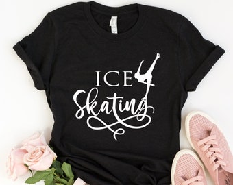 May include: Black t-shirt with white text that says "ICE Skating" and a silhouette of a figure skater.