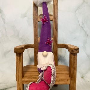 Sitting Pink and Purple Gnome with Butterfly Accents on Hat